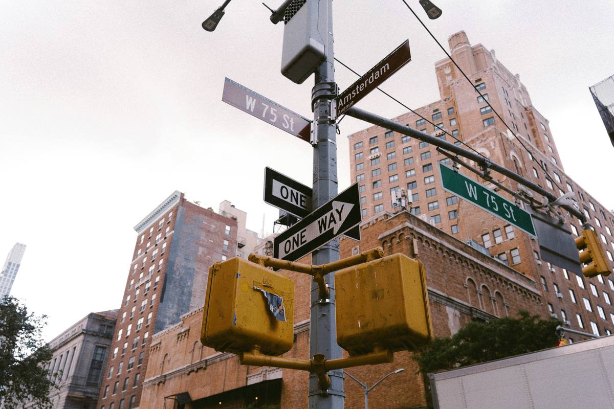 Street signs at the corner of West 75th Street and Amsterdam Avenue in Manhattan