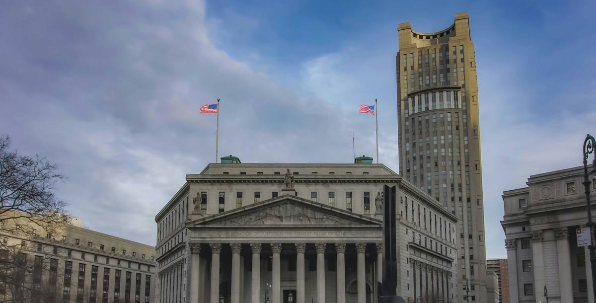 The New York County Supreme Court building at 60 Centre Street with American flags