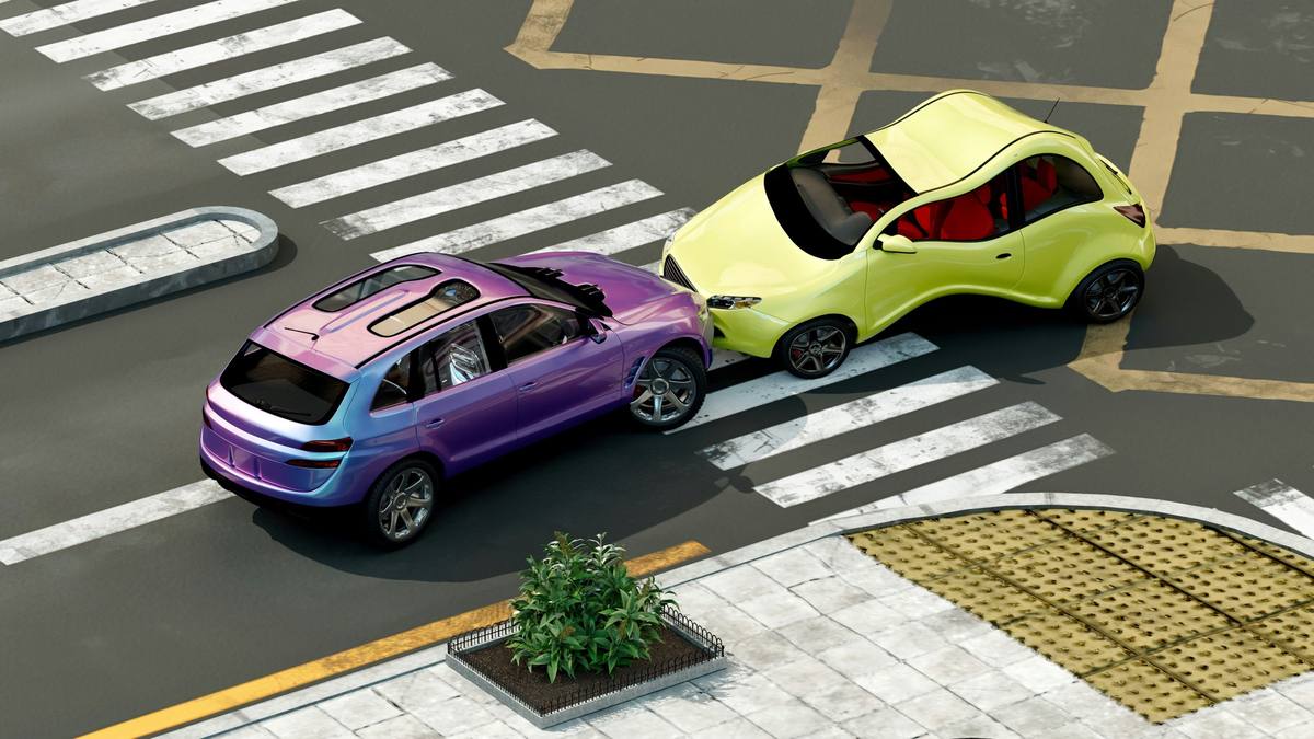 Aerial view of a rear-end collision between two cars at a crosswalk