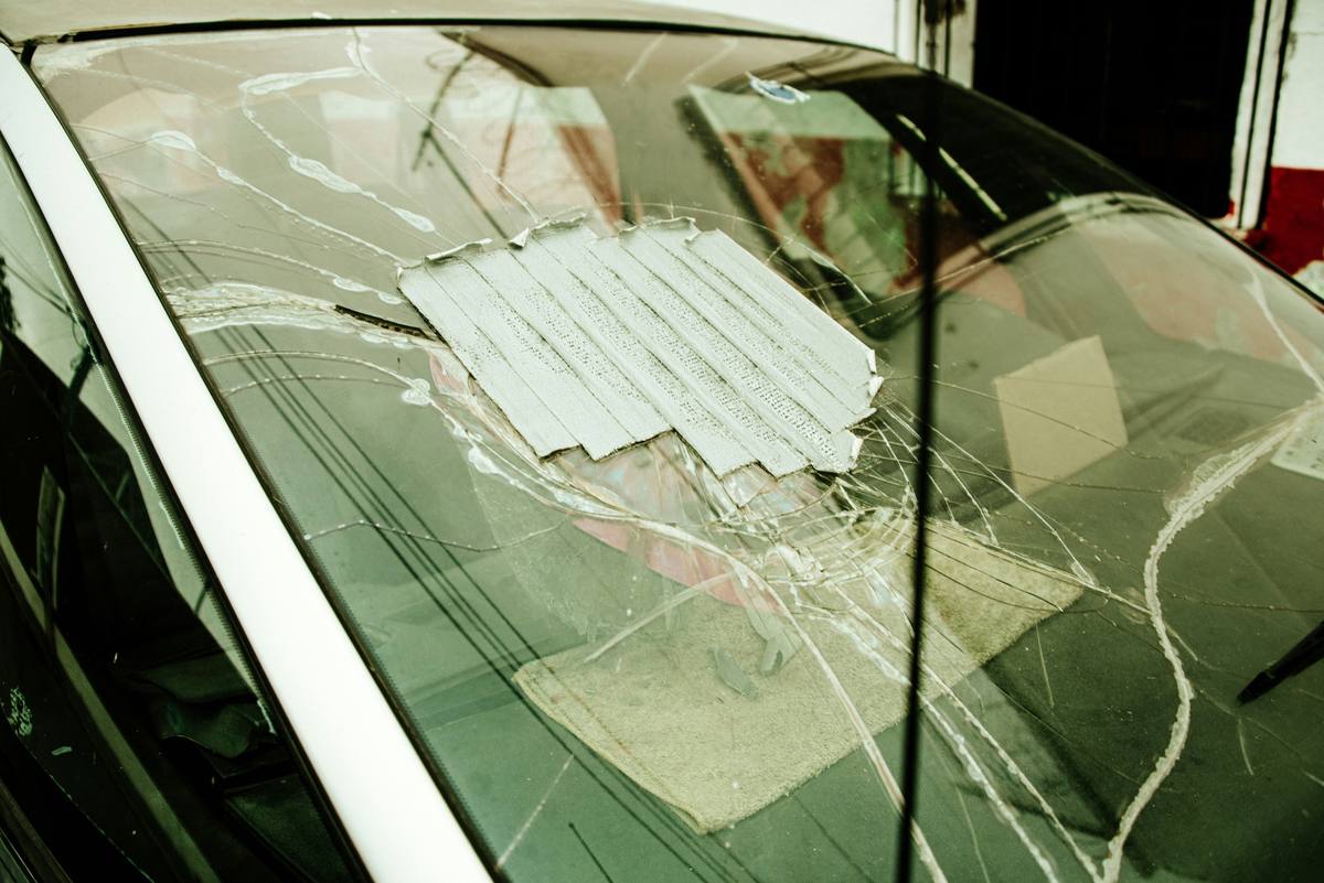 Cracked windshield patched with tape