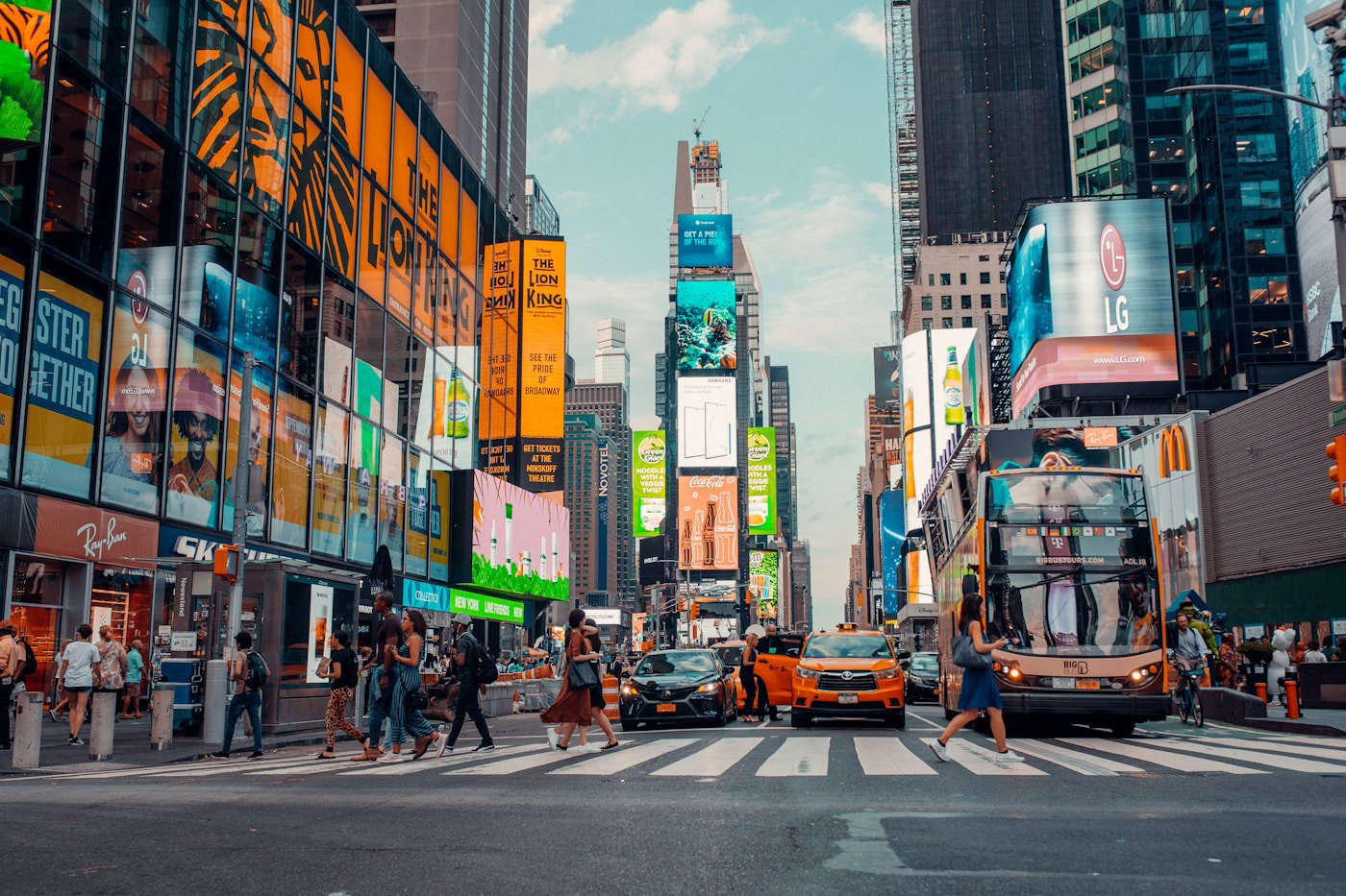 City bus crossing a busy Manhattan intersection